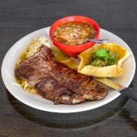 8 oz. Carne Asada · Grilled steak presented on a bed of sizzling onions and bell peppers. Served with Mexican ri...