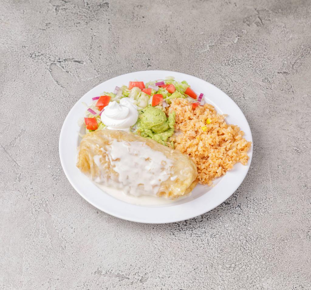 Chimichanaga Dinner · Lightly-fried rolled flour tortilla filled with seasoned shredded chicken, brisket or pulled pork (seasoned with pico de gallo), rice and topped with cheese dip. Served with lettuce, guacamole, a tomato slice and sour cream.