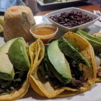 Taco Combination  · A combination of three tacos, chicken, seasoned steak, and marinated pork. Topped with cilan...