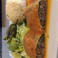 Beef Chile Relleno  · Poblano chile pepper and topped with a mild tomato sauce. Served with a side of rice, beans,...