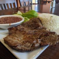 Carne Asada · Marinated flank steak grilled and seasoned to perfection served with rice, house salad, and ...