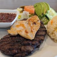 Plato Hacendero · A strip of grilled flank steak and chicken breast served with rice, beans, and a house salad.