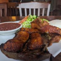 Plato Montanero · A hearty traditional Colombian plate that includes a grilled flank steak, fried egg pork rin...