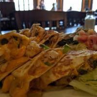 Chicken Quesadilla · Grilled flour tortillas with Monterrey jack cheese, mushrooms, green peppers, and sauteed on...