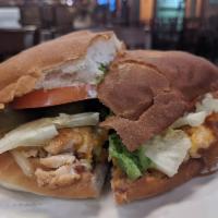 Chicken Torta · A traditional Mexican sandwich made with fresh bread, lettuce, avocado, beans, mayonnaise, j...