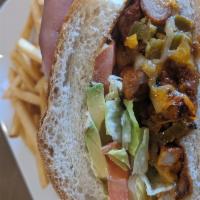 Marinated Pork Torta · A traditional Mexican sandwich made with fresh bread, lettuce, avocado, beans, mayonnaise, j...
