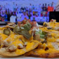 Chicken Nacho · Served with melted cheese, beans, jalapenos, and a side of guacamole, sour cream, and pico d...