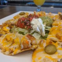 Shrimp Nacho · Served with melted cheese, beans, jalapenos, and a side of guacamole, sour cream, and pico d...