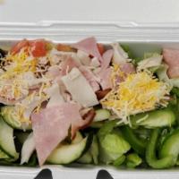 Chef Salad · Romaine lettuce, bell pepper, olives, tomatoes, cucumber, ham, turkey, cheese, and egg