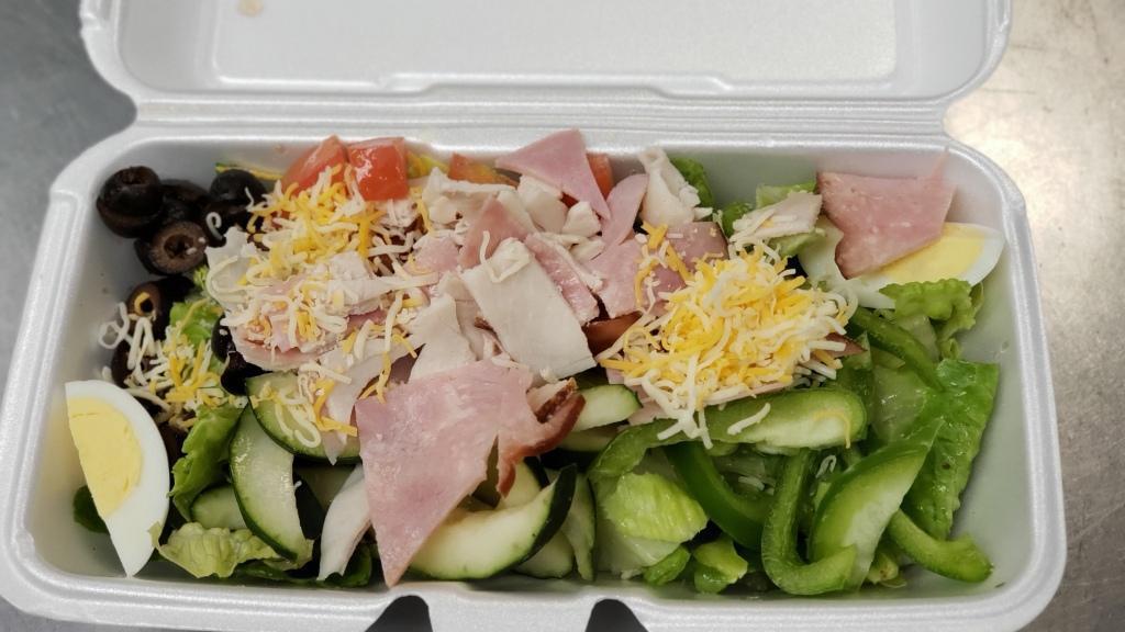 Chef Salad · Romaine lettuce, bell pepper, olives, tomatoes, cucumber, ham, turkey, cheese, and egg
