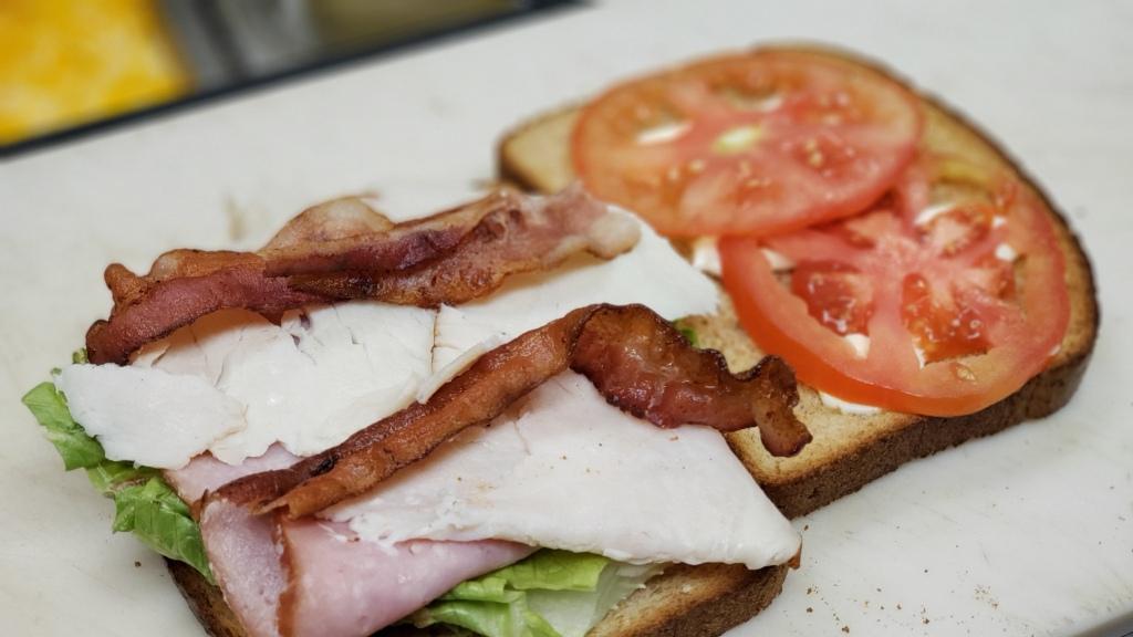 Classic Club Sandwich · Turkey, bacon, ham, lettuce, tomato, mayo & Swiss.