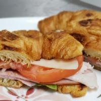 Croissant Sandwich · Turkey, ham, lettuce, tomato, mayo & Swiss.