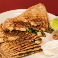 Veggie Only Quesadilla · Spinach, onions, tomato, bell pepper served with sour cream and guacamole on the side.