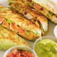 Big Chicken and Veggie Quesadilla · Chicken breast, onions, tomato, bell pepper, cheddar cheese served with sour cream and guaca...