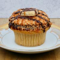 Samoa · Vanilla cake with a caramel filling, topped with buttercream, a chocolate and caramel drizzl...