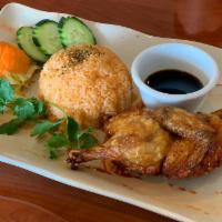 18A. Com Ga Xoi Mo · Fried Cornish hen with special tomato sauce rice or steamed rice.