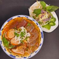 31. Bun Bo Hue · Well-cooked beef and pork with rice stick noodle soup.
