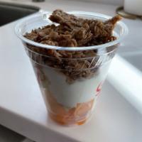 Fruit and Yogurt Granola · 12 oz. container of seasonal fruit under Greek yogurt topped with our house-made granola. Gl...