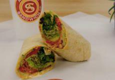 Vegan Veggie & Hummus Wrap · Hummus, cucumber, avocado, sprouts, spring mix, red onions, tomatoes, pepperoncini, and hous...