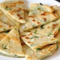 17. Scallion Pancake · Savory folded flatbread. 