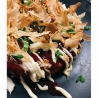 Okonomiyaki · Savory Japanese pancake, katsu glaze, kewpie mayo, pickled ginger, bonito flakes, tempura cr...