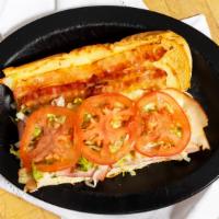Club Grinder · Mozzarella-provolone cheese, ham, turkey, bacon, lettuce, tomato & mayo.