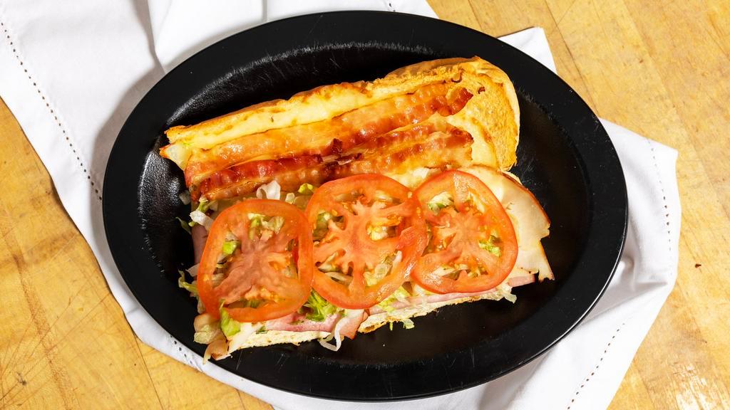 Club Grinder · Mozzarella-provolone cheese, ham, turkey, bacon, lettuce, tomato & mayo.