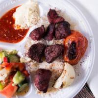 Beef Shish Kabob Plate · tenders chunk of beef (fillet mignon) with grilled tomato & onion; served with rice, salad, ...