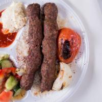 Beef Kulfta Kabob Plate · Skewers ground beef, onion & parsley served with grilled tomato & onion; with rice, salad, p...