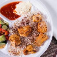 Chicken Kabob Plate · Chicken breast grilled and served with rice, salad, pita bread and sauce