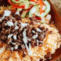 Beef Shawarma Plate · served with rice, salad, pita bread and sauce