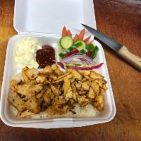 Chicken Shawarma Plate · served with rice, salad, pita bread and sauce