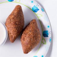 Kibbeh · Mixture of bulgur wheat, onions, and ground beef forms a hollow shell for a delicious stuffi...