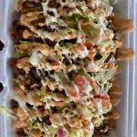 Yaroa de res · French fries, fried sweet plantain, beef, cheese, lettuce, pico de gallo, pink sauce and ran...