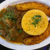 Seco de Chivo · Ecuadorian goat stew. Arroz y plátano verde. Rice and green plantain.