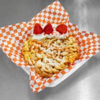 Strawberry Funnel Cake · Deep-fried funnel cake topping with , fresh strawberries and powder sugar, strawberry syrup.
