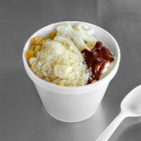 Corn in A Cup · Elote en vaso. Corn, mayonnaise, Parmesan cheese, butter, and chile.
