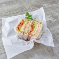 8. Turkey Triple Decker Club Sandwich · With turkey, bacon, lettuce, tomato, mayo on white toast.