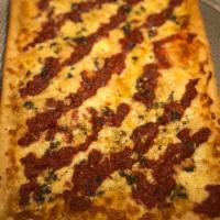 Grandma Sicilian Pizza · Thin crust topped with our freshly grandma sauce, basil, garlic and mozzarella cheese.