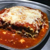 Homemade Baked Lasagna · Layers of lasagana pasta, fresh homemade meat sauce, ricotta cheese and parmesan topped with...