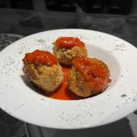 Side of Meatballs parmesan  · Three two Oz meatballs in tomato sauce. 