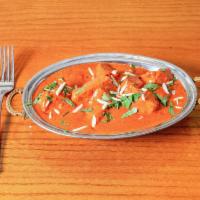 Chicken Tikka Masala · Chunks of roasted marinated chicken in a spiced and creamy curry.