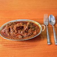 Goat Curry · Goat simmered in aromatic spices and herbs with coconut milk and curry. Bindaloo, kdahi or r...