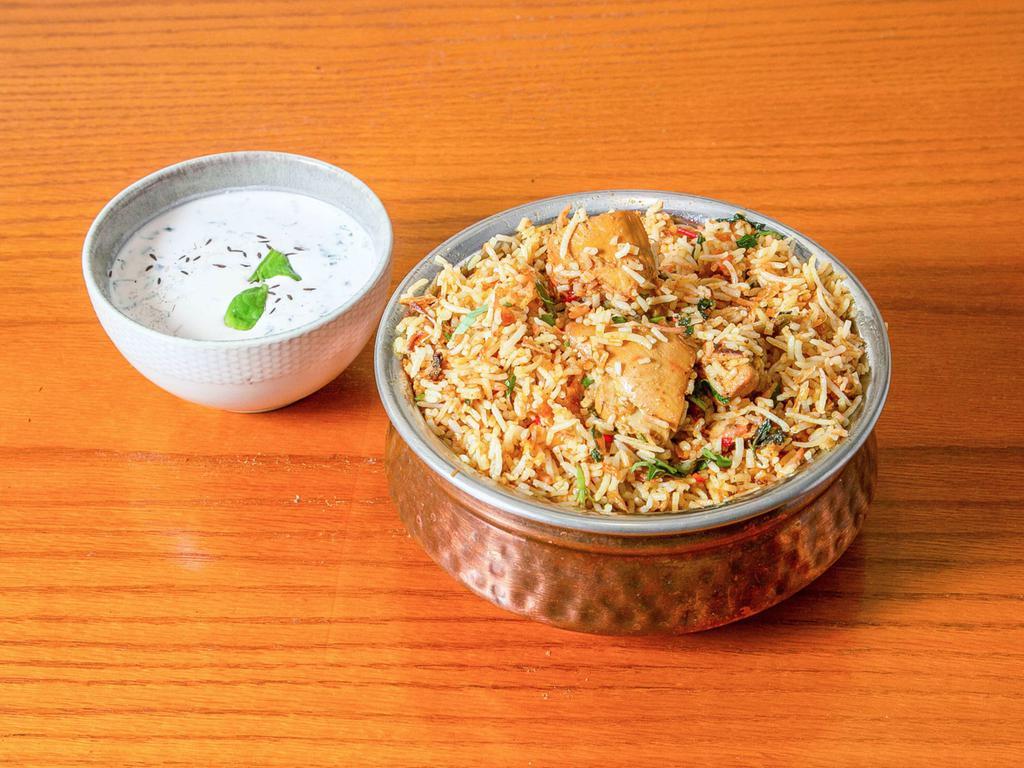 Biryani · Long grained basmati rice flavored with exotic spices, such as saffron, layered.