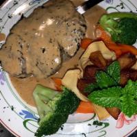 Filet au Poive · Filet mignon broiled with pepper sauce.