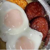 Mangu breakfast platter  · Mashed green plantains /2 over easy eggs /2 fried salami/ 1 fried cheese topped with red pic...