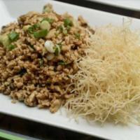 Bangkok's Chicken Wrap · Ground chicken mixed with mushroom, water chestnut, scallion serve with crunchy noodle and l...