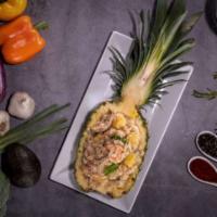 Pineapple Fried Rice · Special house fried rice with pineapple chunks, eggs, carrots, onions and green onions.