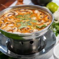 Large Bangkok's Soup · A traditional coconut milk soup with mushrooms, galangal, lemongrass, lime leaves, green oni...