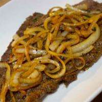 Bistec Encebollado · Steak and onions.